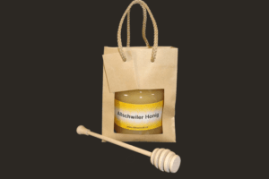 Minitragtasche mit Honig und Honigheber