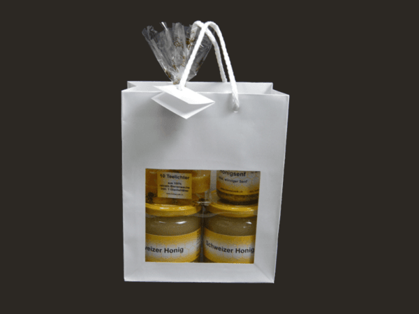 Geschenkset mit Honig, Honigsenf und Teelichtkerzen in Tragtasche mit Sichtfenster