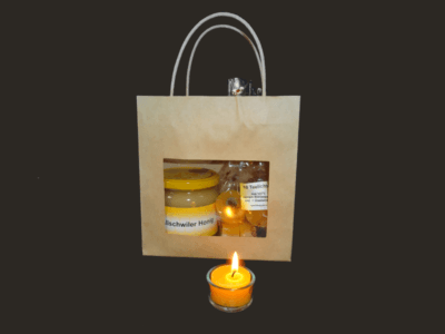Tragtasche mit 500gr Honig und 10 Teelichtkerzen
